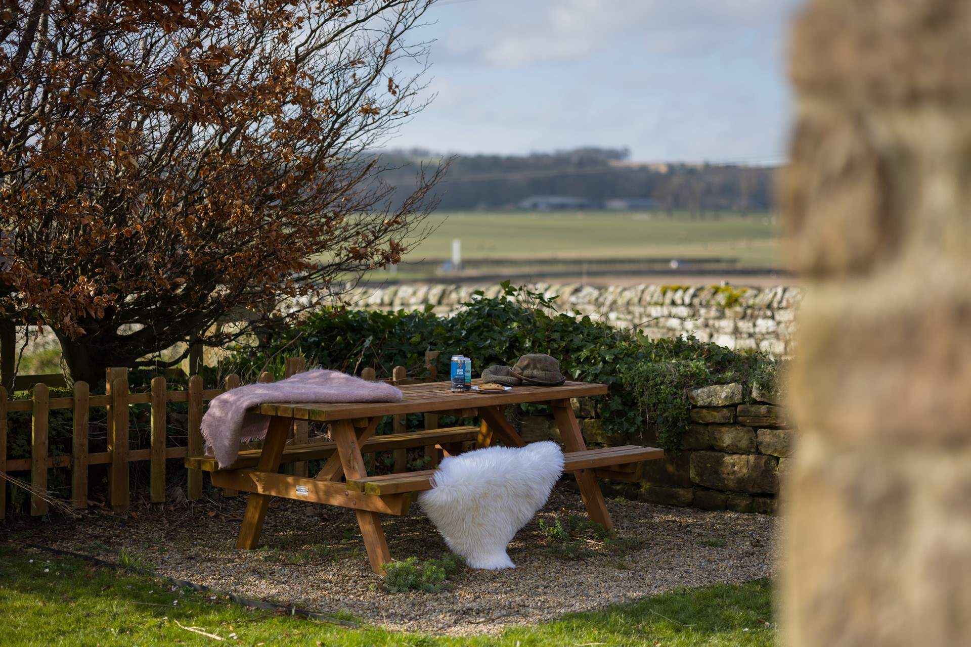 Al fresco dining with a view over the fields towards the sea.