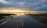 The causeway to Holy Island with receding tide. - Thumbnail Image