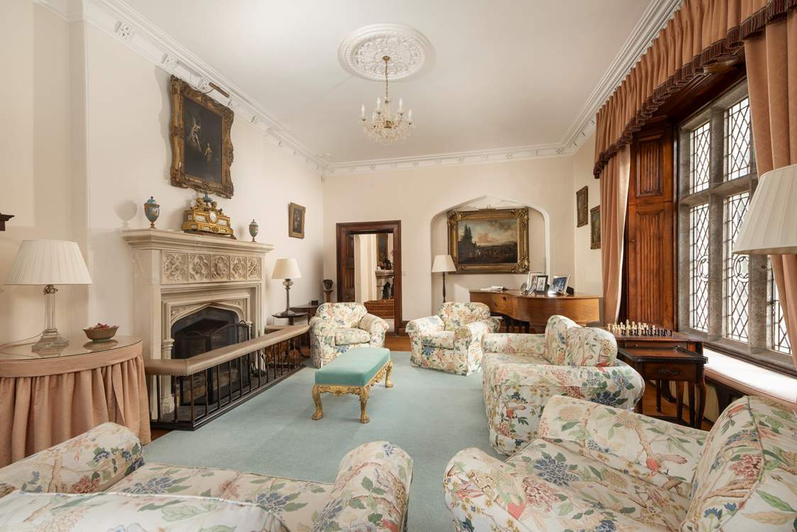 The early sun streams into the first sitting-room, making this the morning room.