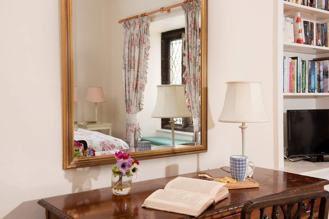 Plenty of bedtime reading and a TV for the guests in bedroom 4.