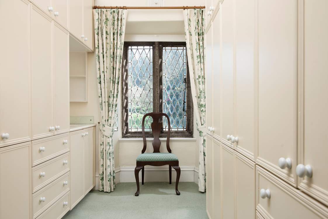 Bedroom 1 has the luxury of a large dressing area, with a separate sink and oodles of storage.