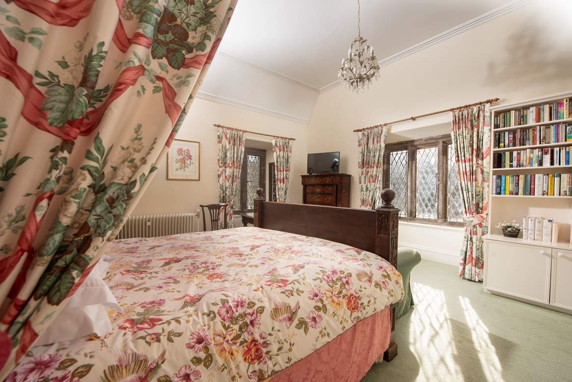 Bedroom 1 has a romantic canopied bed.