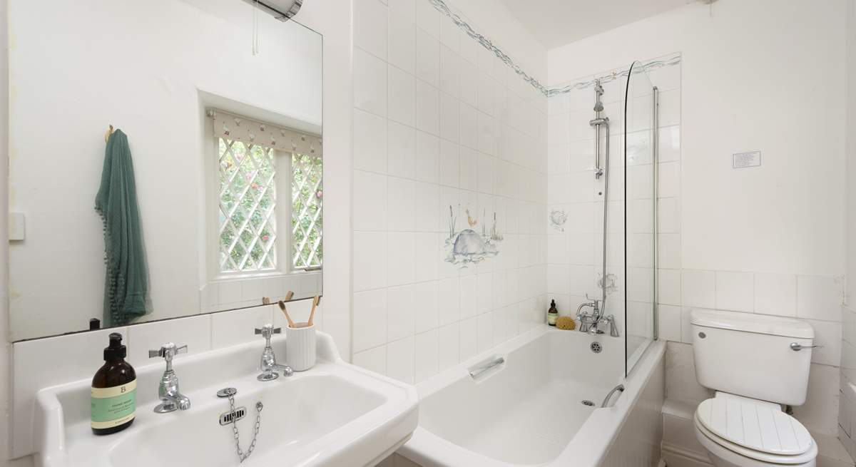 The family bathroom offers a fitted shower above the bath.