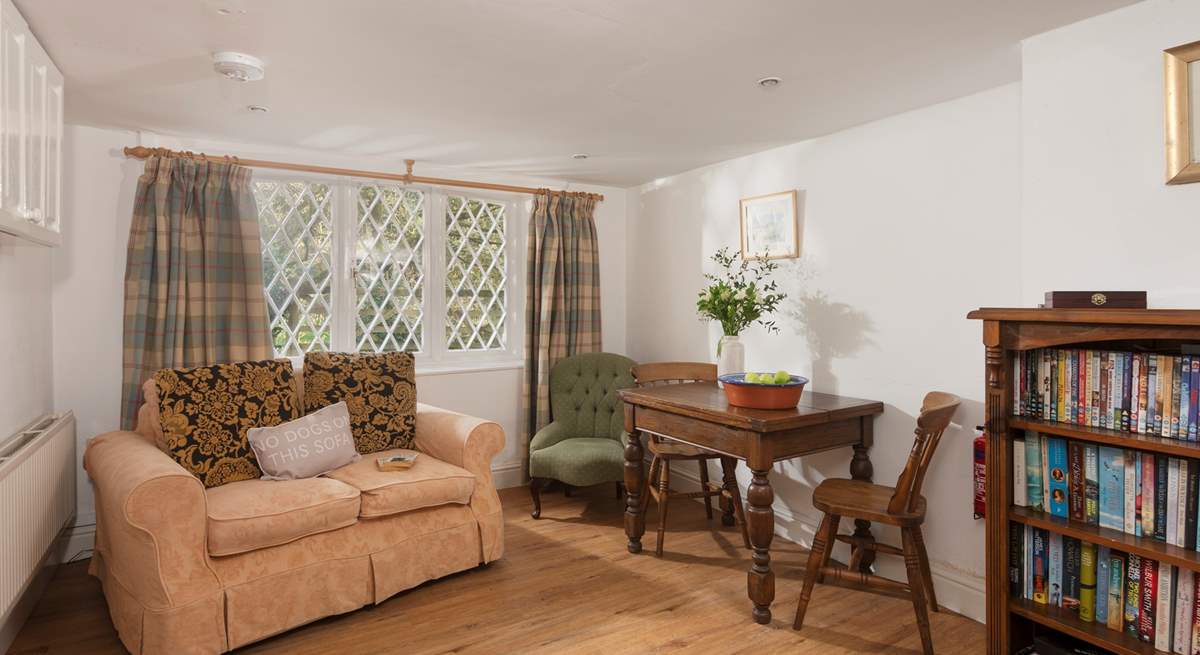 The entrance hall/snug has room to chill out and plenty of books to keep the most avid bookworm amused. 