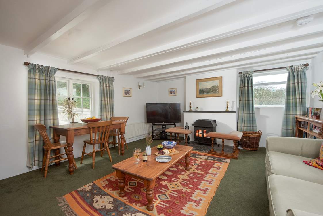 The sitting-room is surprisingly spacious for a traditional cottage. Plenty of room to relax, rewind and reconnect.