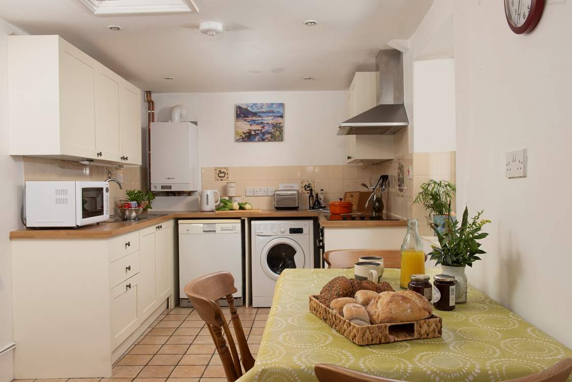 The kitchen/dining-room sits at the back of the cottage with easy access to the terrace and garden - perfect for serving up meals al fresco style.