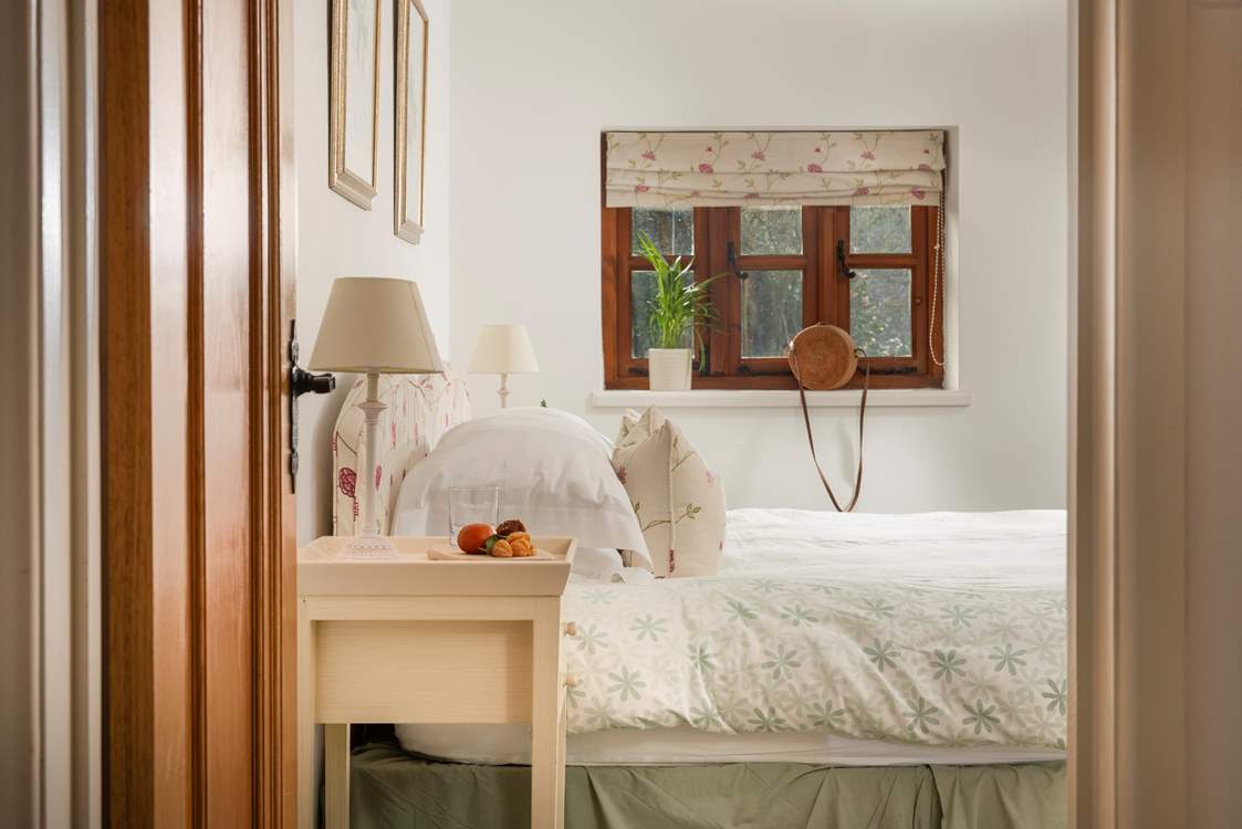 The fourth bedroom sits at the far end of the barn.