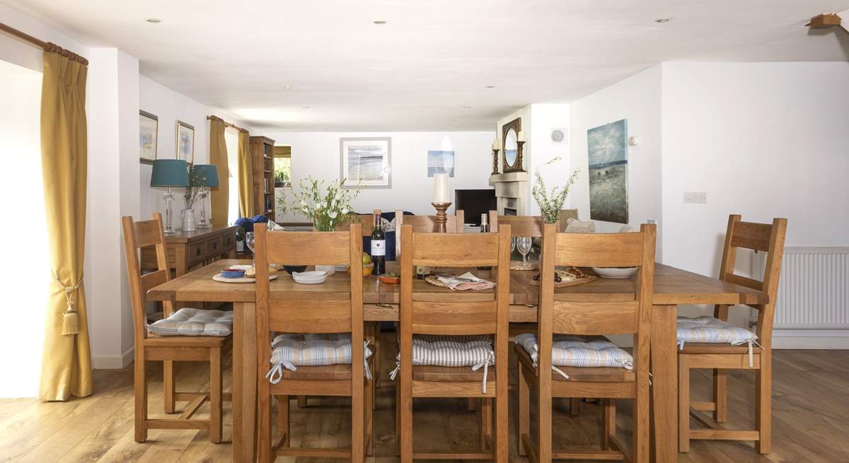 Enjoy holiday meals around the dining-table, which sits between the kitchen-area and the sitting-area, making it a very sociable space.