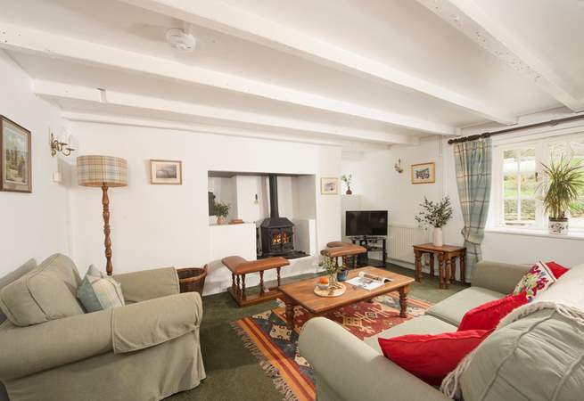 The cosy sitting/dining-room is waiting to greet you.