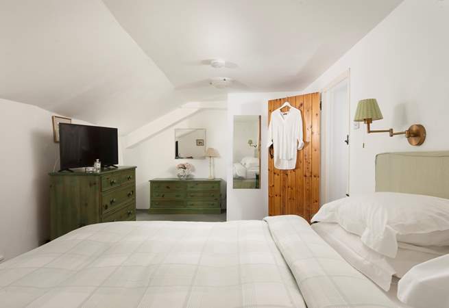 The bedroom is surprisingly spacious.