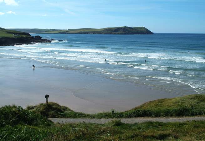 The waves at Polzeath attract surfers from far and wide.