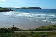 The waves at Polzeath attract surfers from far and wide.