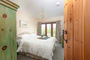 Take a peek into bedroom two - where a king-size bed awaits.