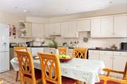 Enjoy holiday meals together, gathered around the dining-table.