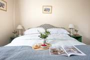 Snuggle up under the covers of the king-size bed in bedroom one.