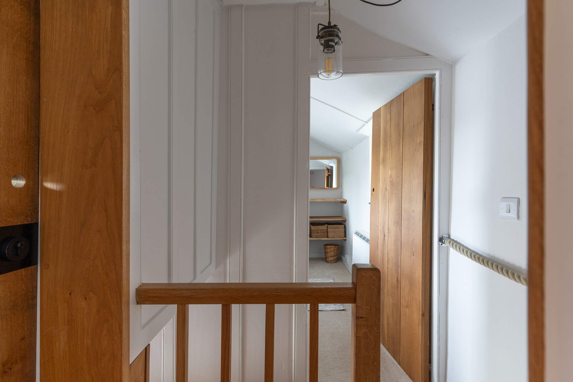 Step leads from the shower-room over to the bedroom. 