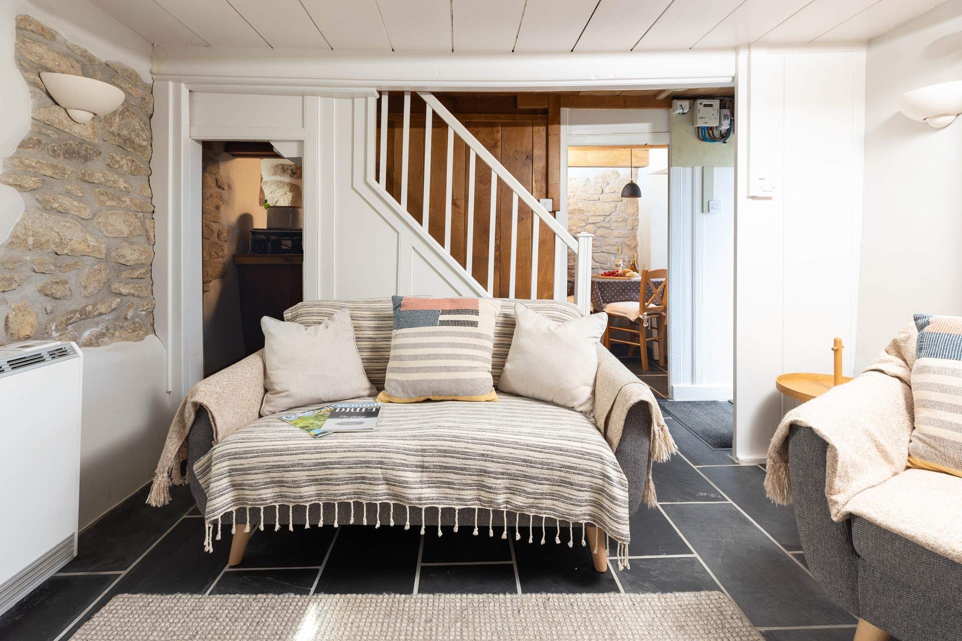 Narrow stairs lead up to the first floor. 