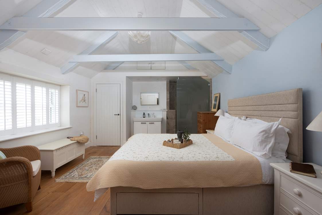 The shower is located behind the glazed glass door.