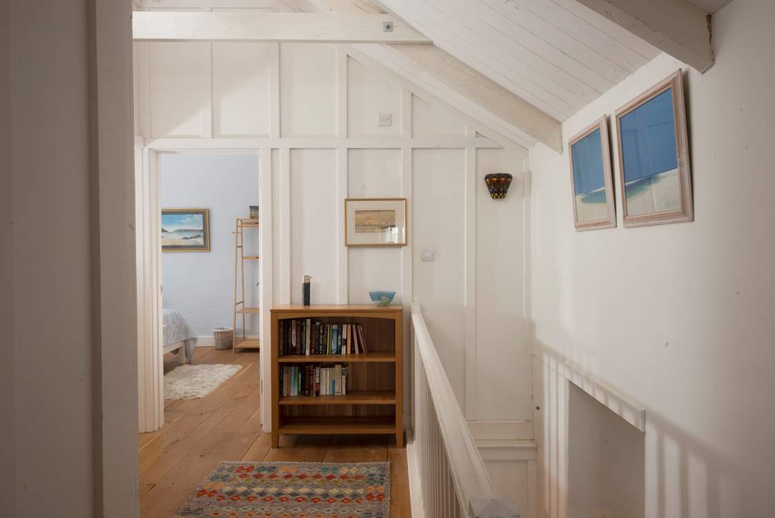 The landing has walls which are full of local art work.