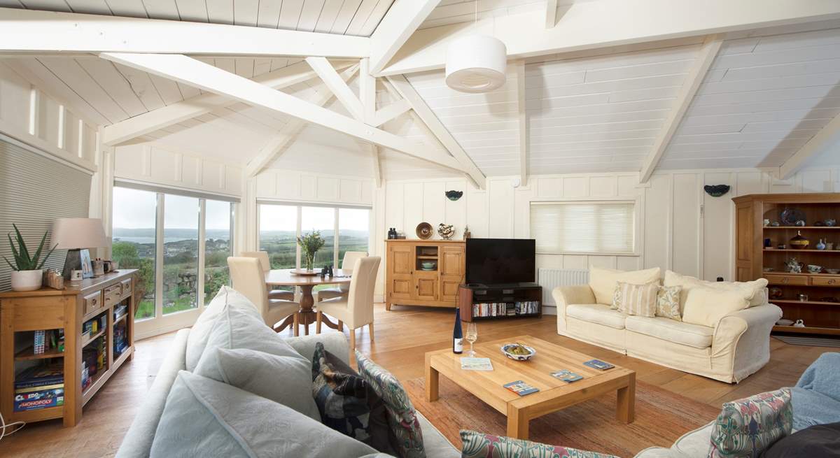 The large open plan sitting-room is light, airy and a real delight, perfect in all seasons.