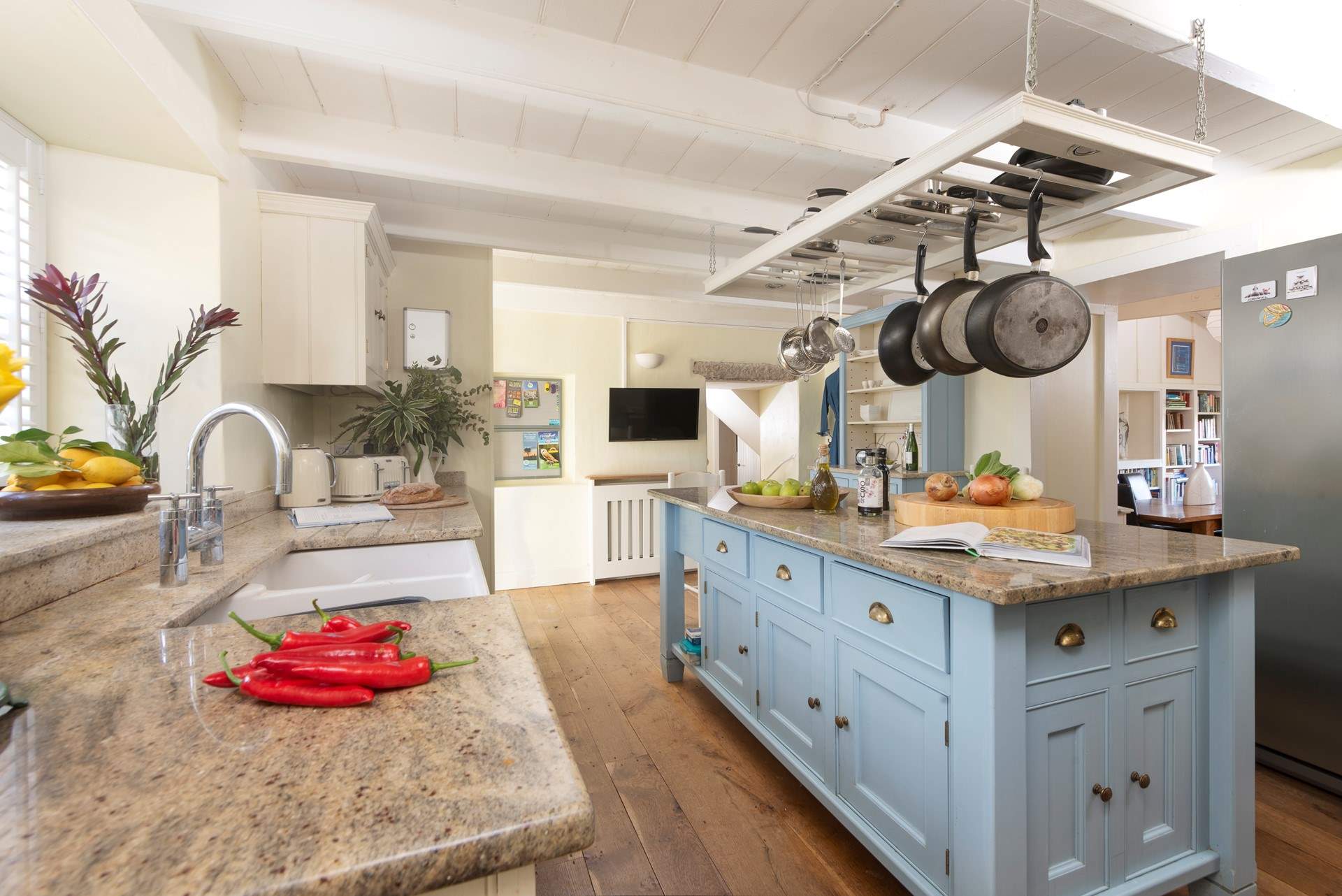 The country style kitchen is a great space for cooking up lazy lunches or intimate suppers.