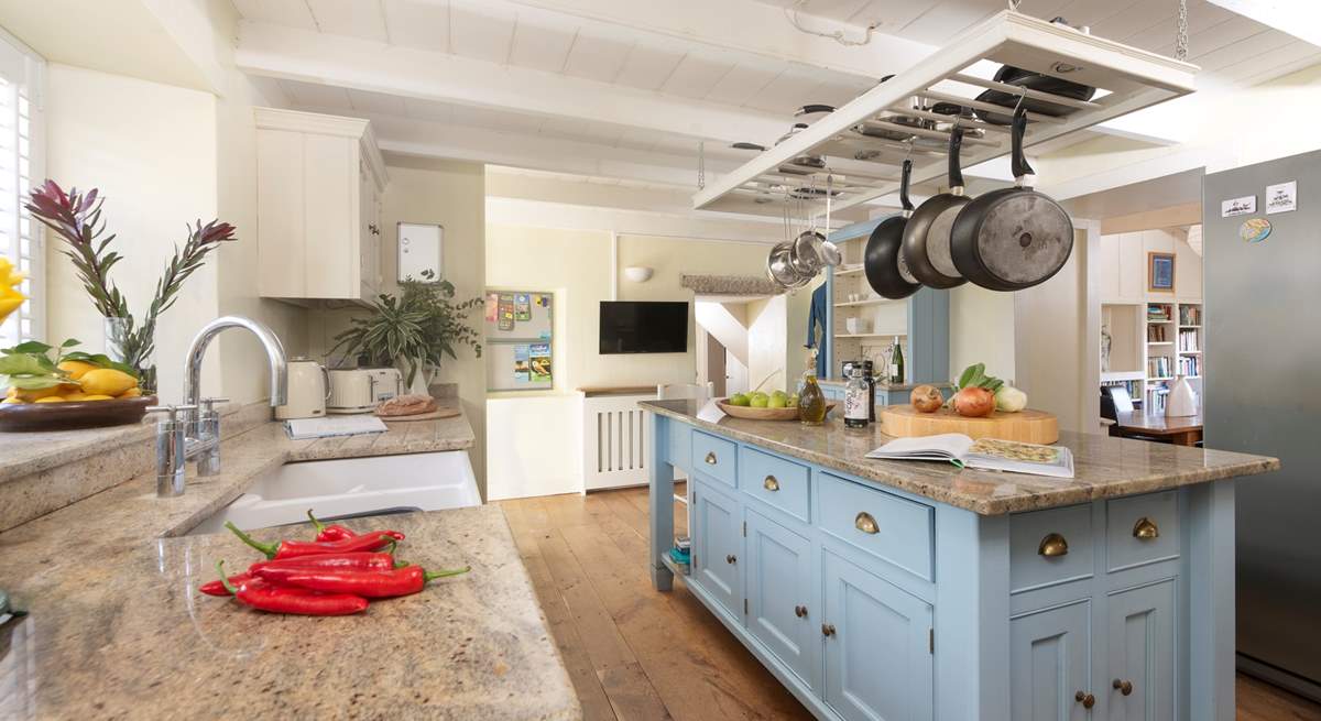 The country style kitchen is a great space for cooking up lazy lunches or intimate suppers.