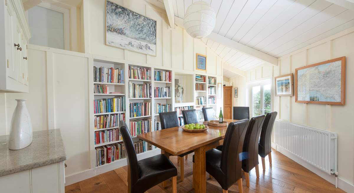 Next to the kitchen (down two steps) lies a super handy utility cupboard with a washing machine and tumble drier. You will also find the more formal dining-table in this room. 