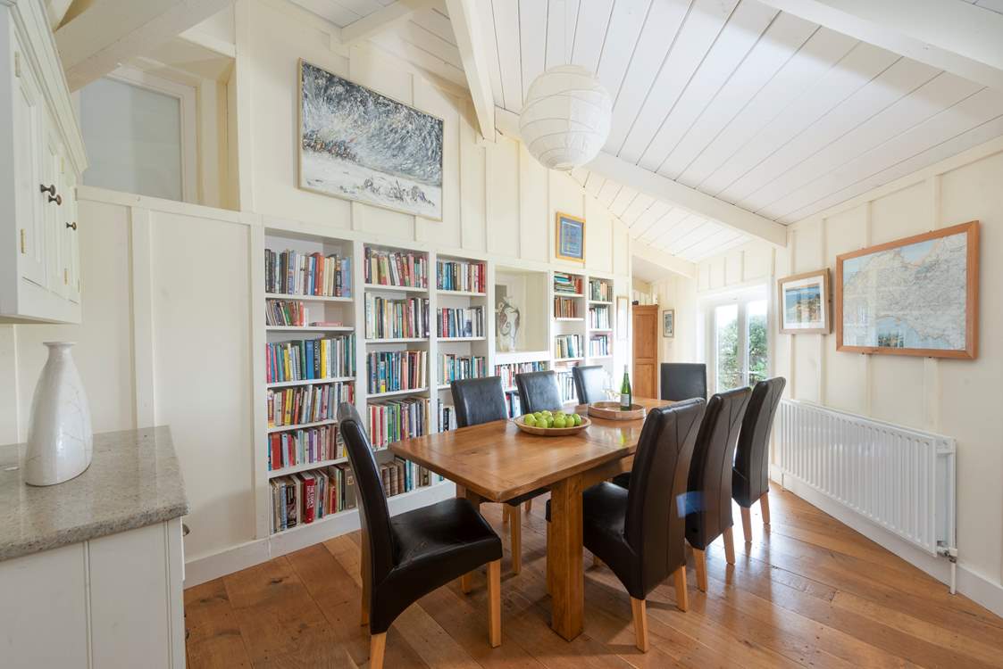 Next to the kitchen (down two steps) lies a super handy utility cupboard with a washing machine/drier. You will also find the more formal dining-table in this room.
