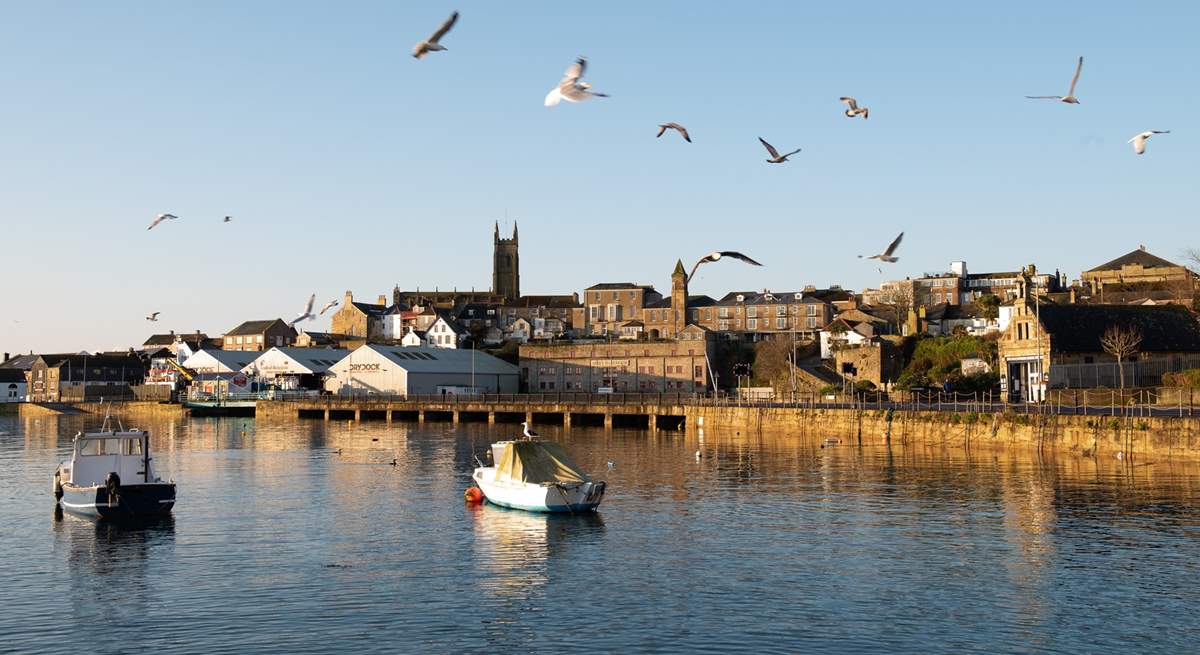 Spend a day in Penzance, take a walk along the harbour and stop for a cream tea in one of the many cafes dotted around the town. 