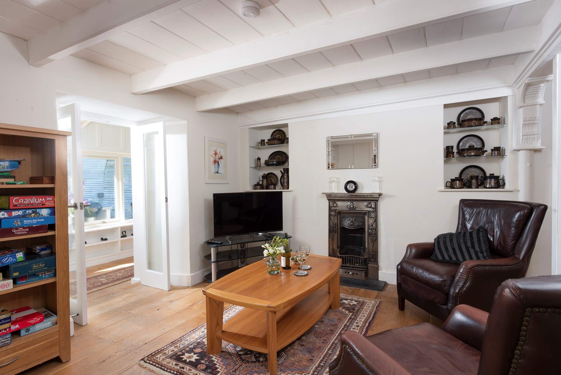 Relax in front of the TV in the separate study/snug area. 