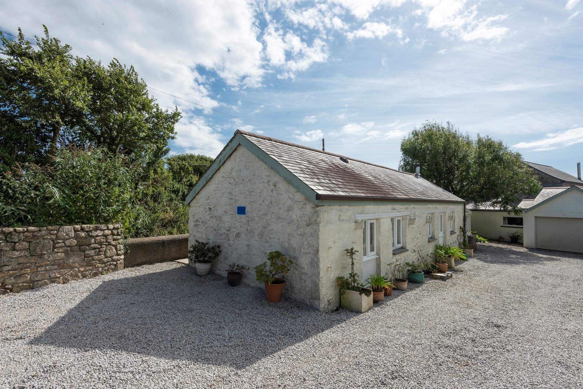 This is the gravel driveway shared with Mounts Bay Cottage which is opposite Trebarvah Farmhouse. 