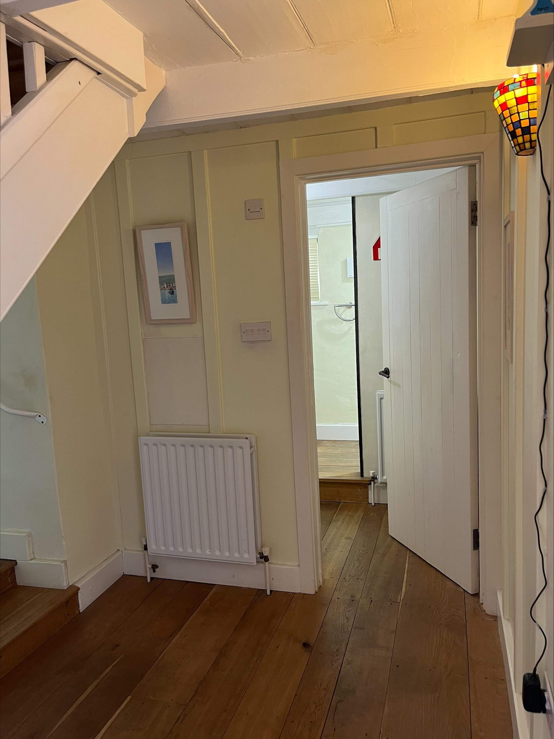 There is one step up to the downstairs shower room, the bedroom is just next door.