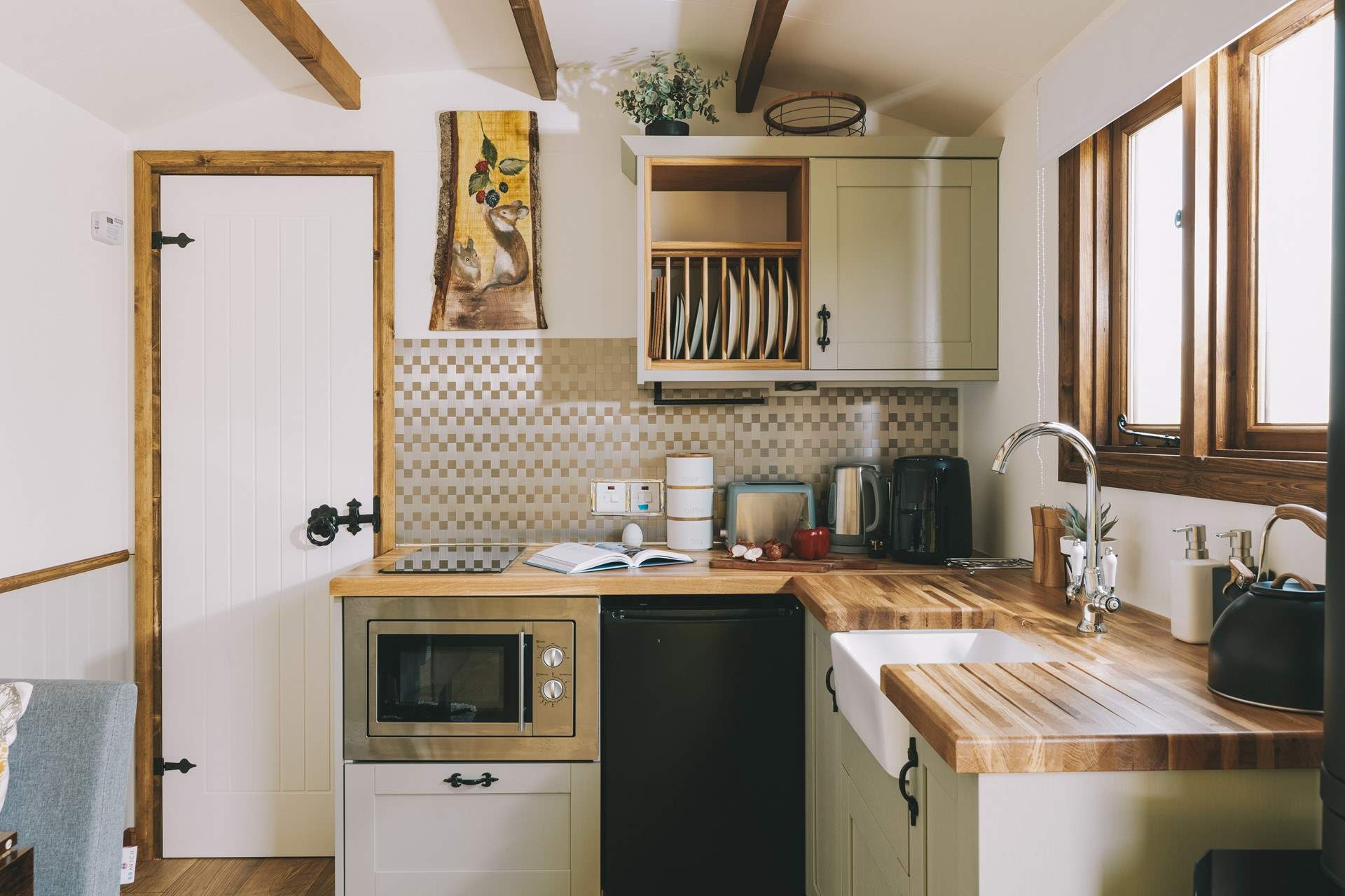 The stylish kitchenette is well-equipped.