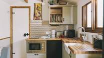 The stylish kitchenette is well-equipped.
