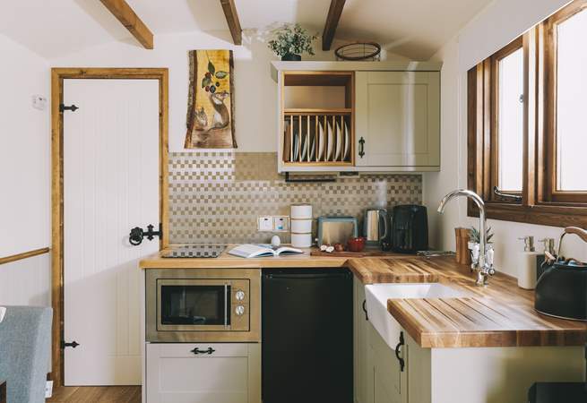 The stylish kitchenette is well-equipped.