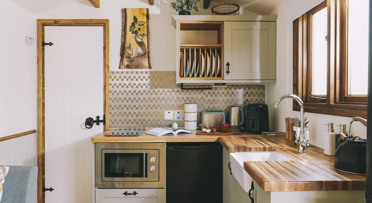 The stylish kitchenette is well-equipped.