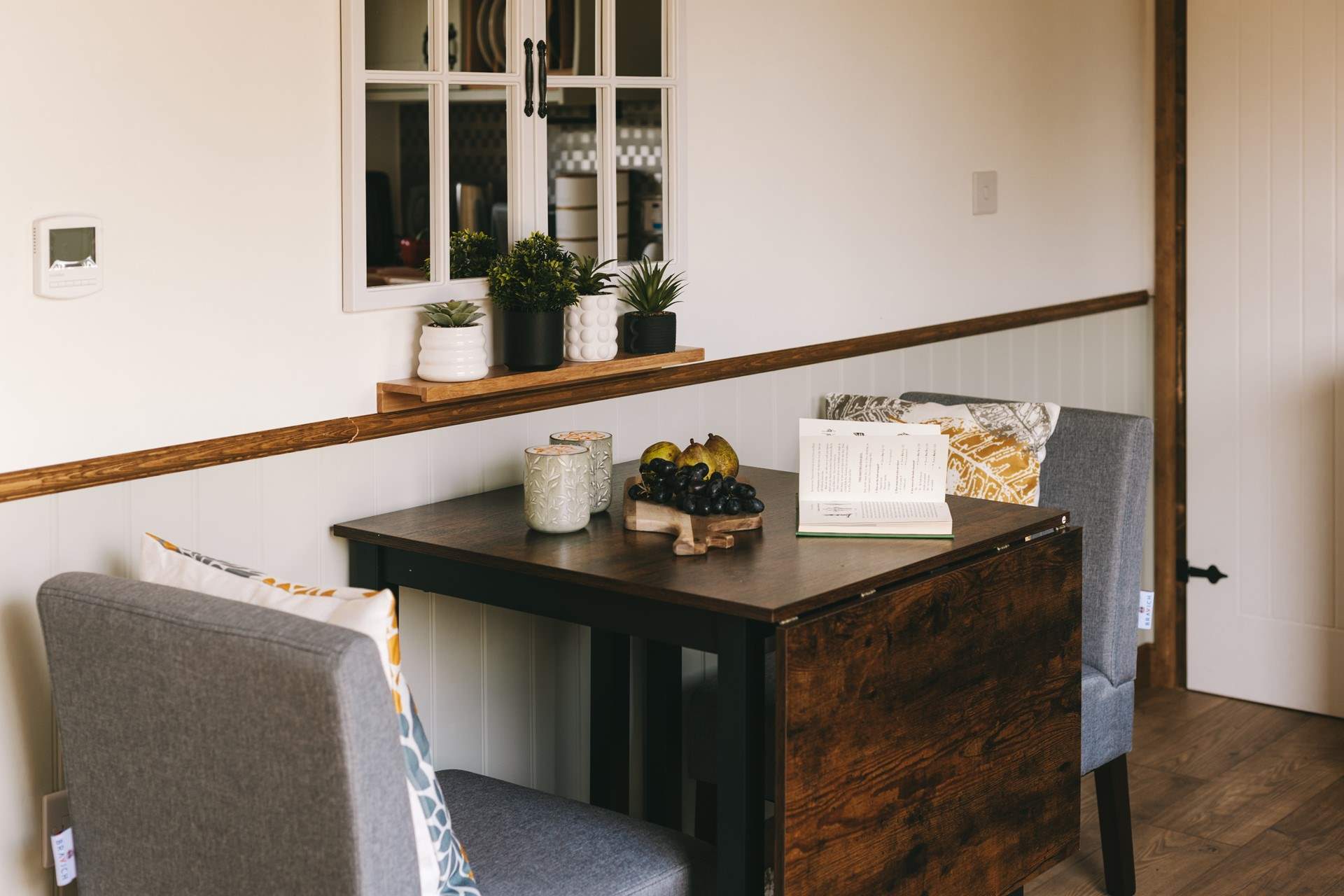 Take a pew and enjoy a morning brew with a view out of the hut doors.