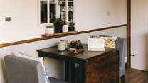 Take a pew and enjoy a morning brew with a view out of the hut doors.