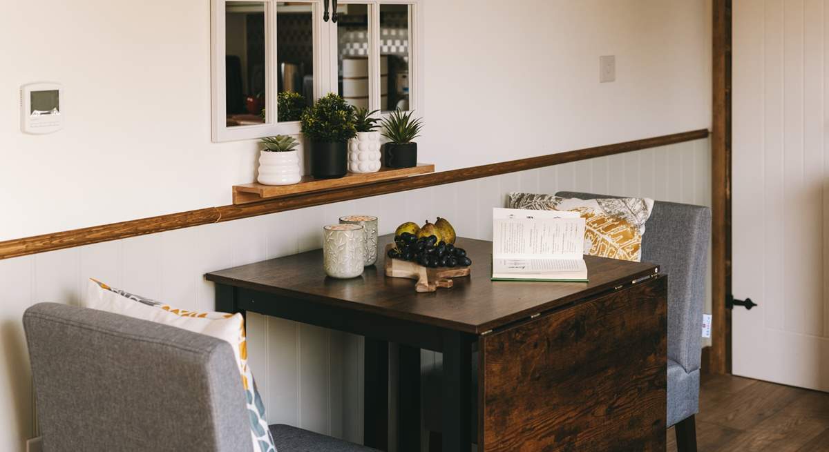 Take a pew and enjoy a morning brew with a view out of the hut doors.