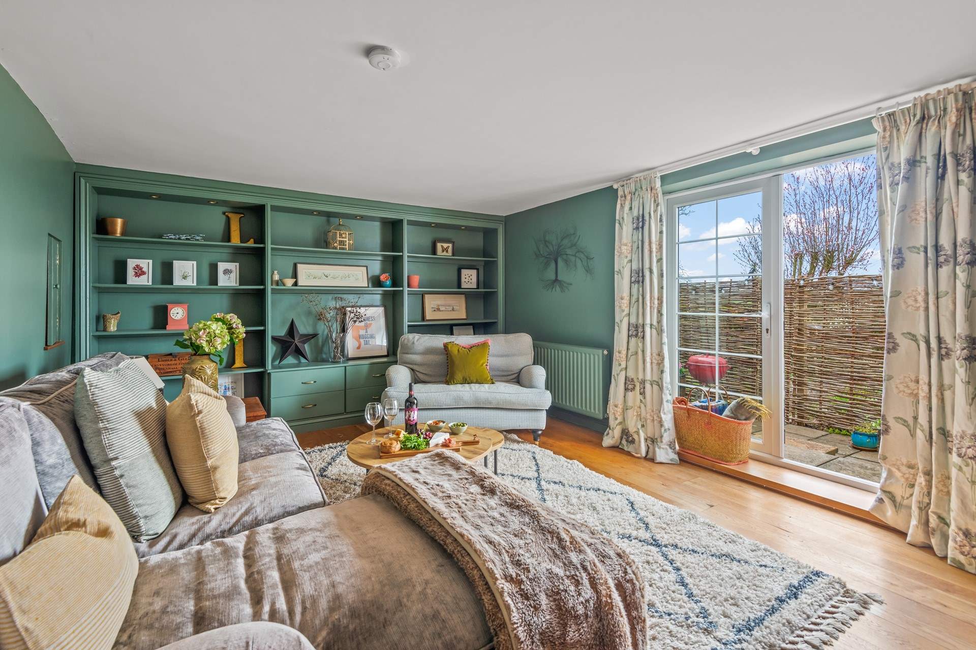 The beautiful sitting-room opens up into your enclosed patio-area.