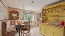 The dining space is both spacious and inviting. Perfect for four lucky guests.