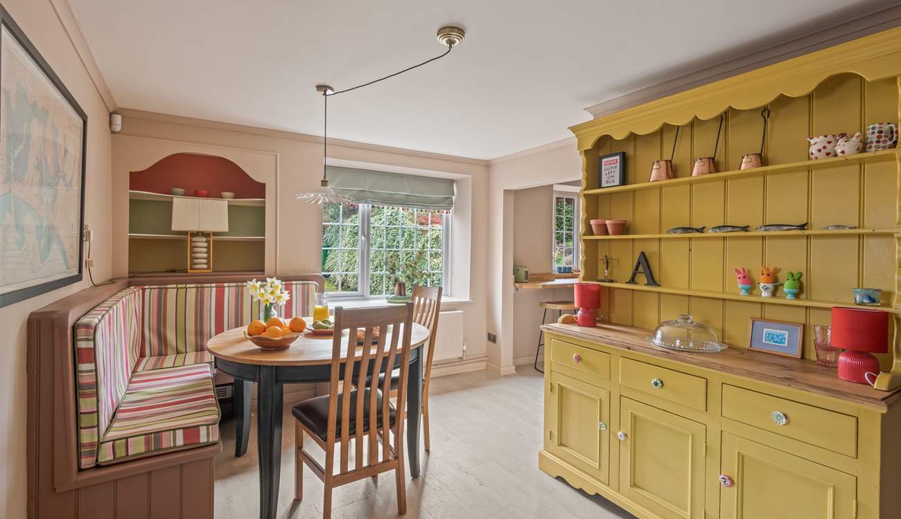 The dining space is both spacious and inviting. Perfect for four lucky guests.