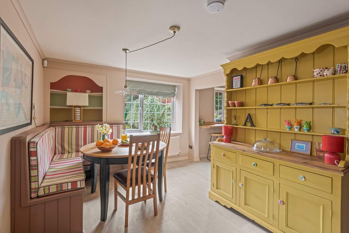 The dining space is both spacious and inviting. Perfect for four lucky guests.