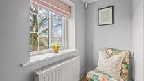 Bedroom one even offers this cosy chair to sit back in and enjoy a good book in total tranquility.