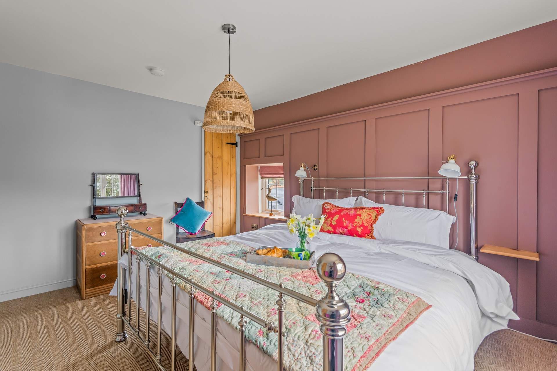 Bedroom two is full of light and bright, cheerful colours.