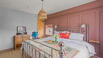 Bedroom two is full of light and bright, cheerful colours.