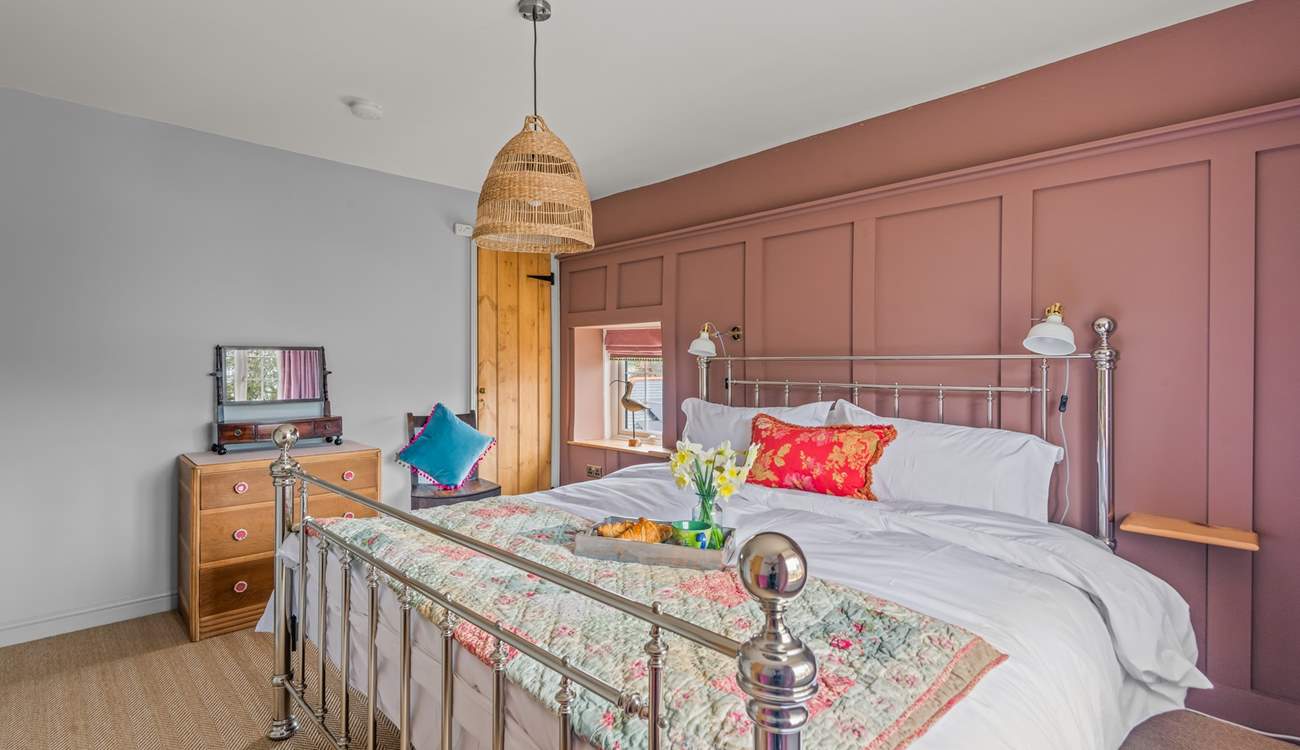 Bedroom two is full of light and bright, cheerful colours.