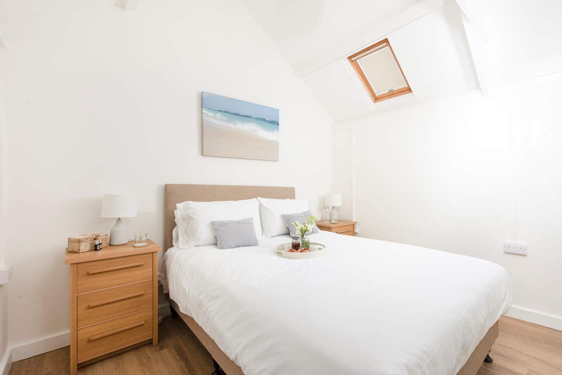 Cosy bedroom 1 has a king-size bed.