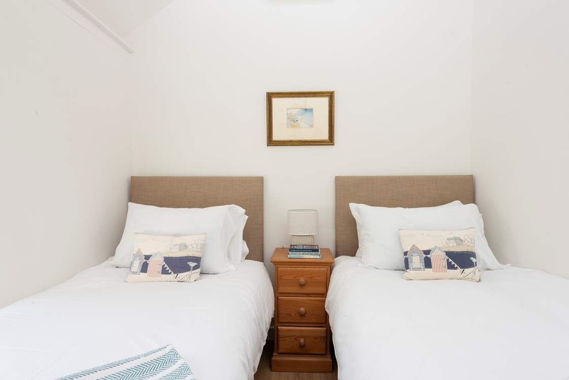 Sleep tight in this snug twin bedroom.