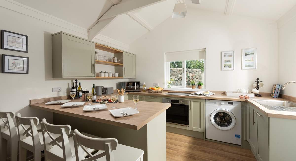 The luxury kitchen reflects the style of this delightful cottage.